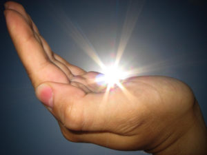 energy healing with light in hand